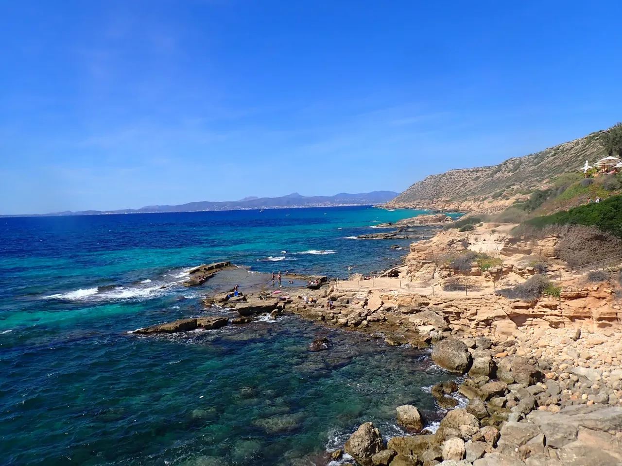 Rocky coastline on Mallorca with clear turquoise water